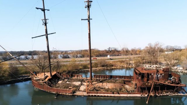 Long shot of a sunken ship from a drone