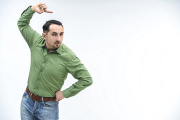 Creative teacher explains new material, gesticulating expressively and making grimaces.