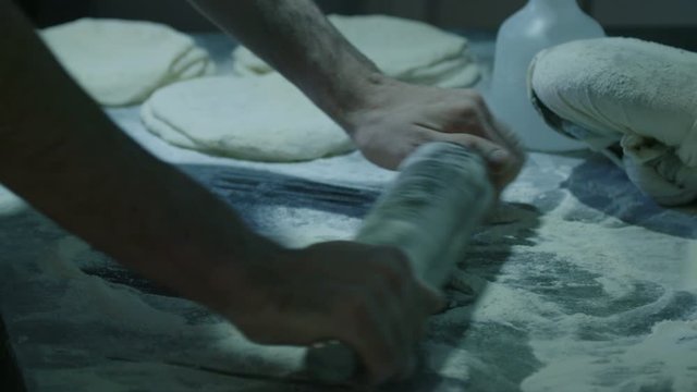  Rolling the dough for baking the bread - slow motion
