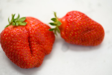 Fresh organic strawberries isolated on a white background. Delivery of natural products. Packaging made from organic strawberries.