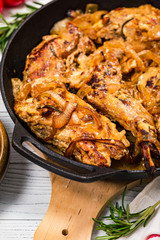 Fried Rabbit with Rosemary, Garlic and Sour Cream Sauce. Selective focus.