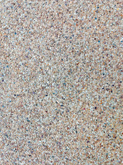 Lots of many little stone background on the floor surface.
