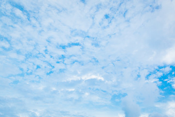 white fluffy clouds in the blue sky
