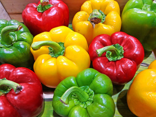 Fresh Red Yellow and Green sweet pepper in the street market. Colorful bell peppers.