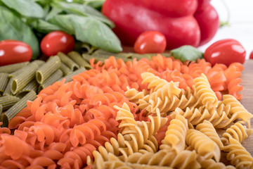 Assortment of different types of gluten-free penne pasta from chickpeas, red lentils, peas