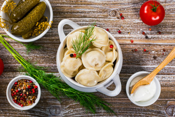 Russian Pelmeni Meat Dumplings on Rustic Metal Background. Selective focus.