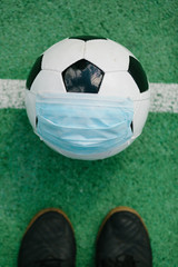 Soccer football with face mask for sports during covid-19 pandemic