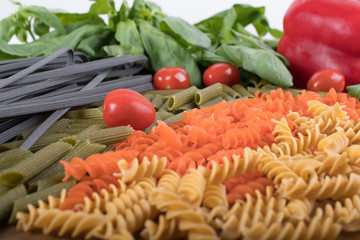 Assortment of different types of gluten-free penne pasta from chickpeas, red lentils, peas