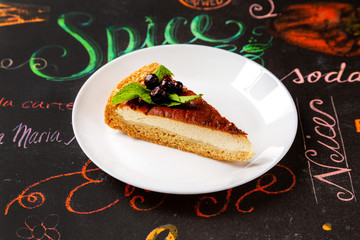 A piece of cake on a plate, cake, sweet dessert for lunch.
