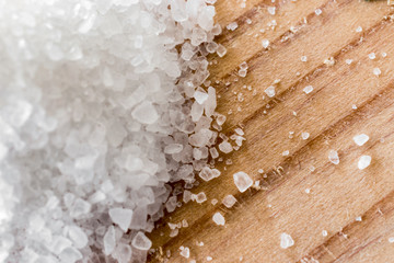 Pinch of salt on a cutting board.