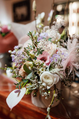 Beautiful bouquet in pastel shades with white peonies and koalas
