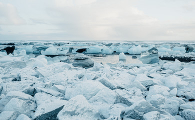 Breathtaking diamond beach on Iceland in winter with large ice blocks, ice cubes