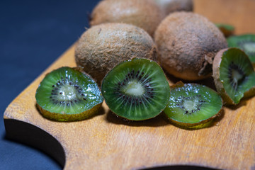 kiwi fruit on a wooden surface