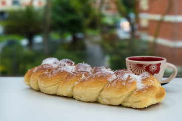 Sweet bread with extraordinary good taste and a cup of coffee