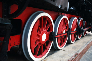 red wheels of an old steam locomotive.