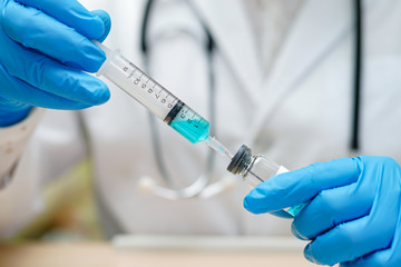 Fototapeta premium Novel Coronavirus Covid-19 vaccine development medical with syringe for doctor use to treat pneumonia illness patients.
