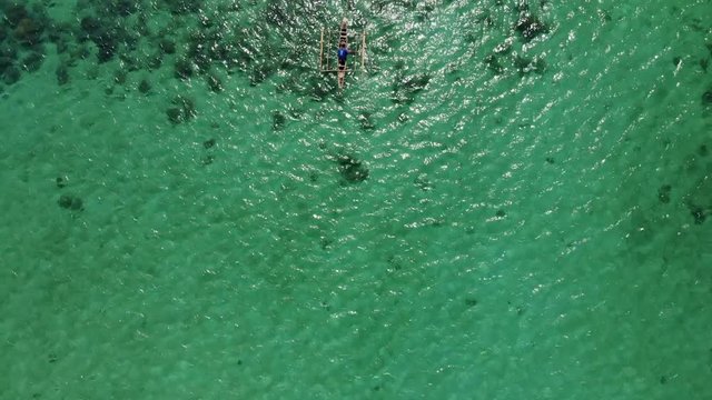 Flying over fisherman's boat next to Bantayan island, Cebu, Philippines