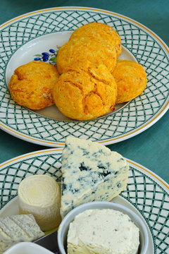 A gourmet cheese platter with ripened goat cheese and blue cheese