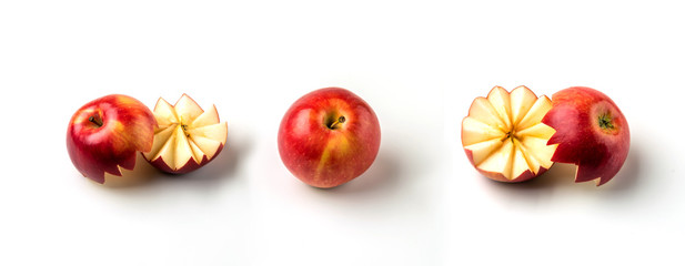 A whole red apple and a cut apple on a white background.