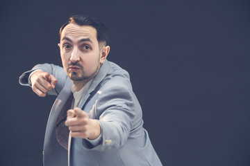 Police detective or a spy doing surveillance work with concerned facial expression.