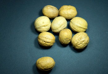 Dried fruits, walnuts. Black background.