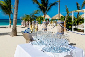 Margarita cocktails, lemonade and champagne sparkling wine glasses on beach outdoor catering event 