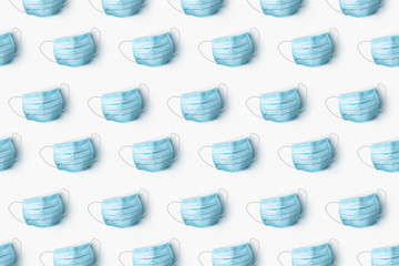 Health care pattern from medical masks on a white background.