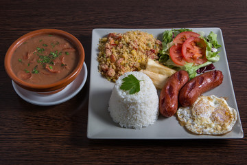 Combined dish with sauseges, egg.