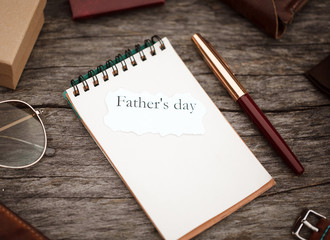 notebook and pen on wood