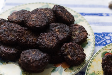 Kofta meatballs, a popular meal in Turkey. Type of kebab. Traditional southern European dish. Front view. Turkish meatballs kuru kofte served on a plate