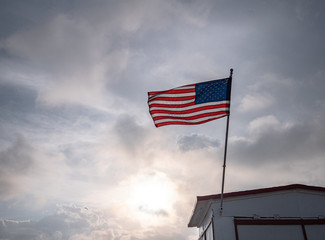 American flag in cloudy weather