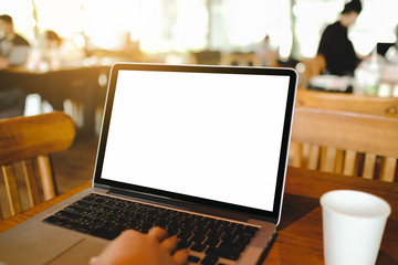 Close up of woman using cell laptop sorder products for shopping online within the cafe.