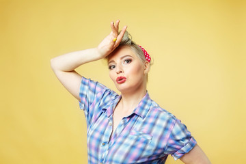 beautiful blonde posing on a yellow background