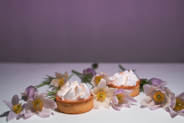 Delicate white flowers and pastries with white cream