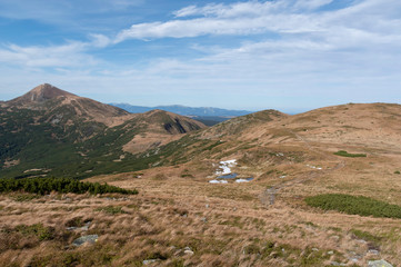 View of the mountain trail. The path to high mountain. The road to the highest mountain. Day trip...