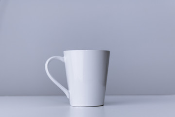 Porcelain mug for coffee and tea on white background