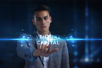Business, Technology, Internet and network concept. Young businessman working on a virtual screen of the future and sees the inscription: Venture capital
