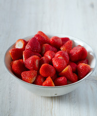 strawberries on a white wooden surface