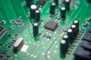 Electronic card-board with some components. Focus. Blured. Macro photo. Zoom. Liitle. Big. Enhanced...