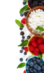 fresh cottage cheese and berries isolated on white