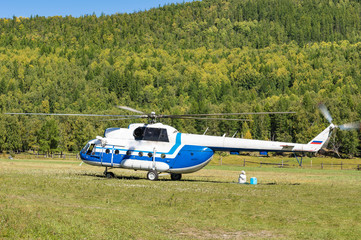 takeoff and landing helicopter in the mountains