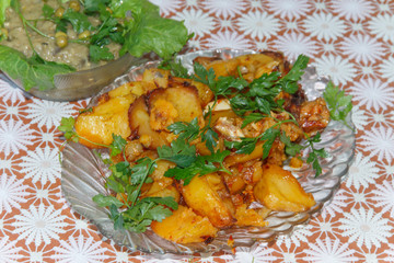  cooked in the oven, potatoes with parsley next to the salad