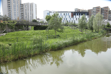 City gardens with skyscrapers and water. Paris France
