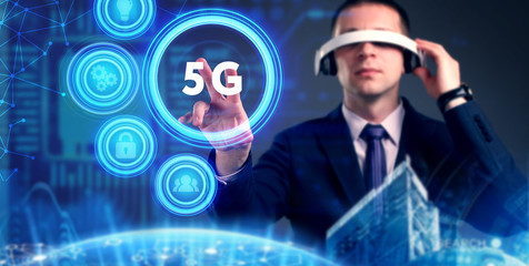Business, Technology, Internet and network concept. Young businessman working on a virtual screen of the future and sees the inscription: 5G