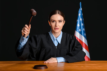 Female judge at table in courtroom