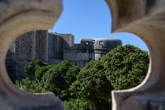 Fototapeta View of the fortress, wall, through a window in Dubrovnik, formerly Ragusa, city located on the Dalmatian coast, Croatia, Europe