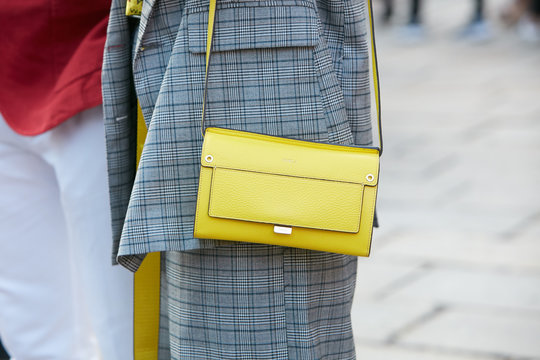 Woman with yellow leather Furla bag on September 22, 2017 in Milan, Italy