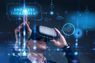 Business, Technology, Internet and network concept. Young businessman working on a virtual screen of the future and sees the inscription: Employee engagement