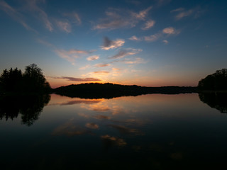 Amazing sunset, with beautiful sky reflections in the water of Hancza lake. Suwalski landscape park, Podlaskie, Poland