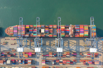 Container , container ship in export and import business and logistics. Shipping cargo to harbor by...